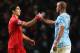 MANCHESTER, ENGLAND - DECEMBER 26: Luis Suarez of Liverpool shakes hands with Vincent Kompany of Manchester City after the final whistle during the Barclays Premier League match between Manchester City and Liverpool at Etihad Stadium on December 26, 2013 in Manchester, England. (Photo by Jan Kruger/Getty Images)