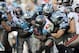 Dec 1, 2013; Charlotte, NC, USA; Tampa Bay Buccaneers running back Bobby Rainey (43) gets stopped by Carolina Panthers linebacker Thomas Davis (58), defensive tackle Colin Cole (91) and linebacker Luke Kuechly (59) during the second half of the game at Bank of America Stadium. Carolina wins 27-6. Mandatory Credit: Sam Sharpe-USA TODAY Sports