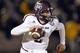 Nov 30, 2013; Columbia, MO, USA; Texas A&M Aggies quarterback Johnny Manziel (2) scrambles to the outside against the Missouri Tigers during the first half at Faurot Field. Mandatory Credit: Peter G. Aiken-USA TODAY Sports