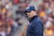 Nov 9, 2013; Minneapolis, MN, USA; Penn State Nittany Lions head coach Bill O'Brien walks off the field after checking on an injured player in the first quarter against the Minnesota Gophers at TCF Bank Stadium. Mandatory Credit: Brad Rempel-USA TODAY Sports