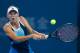 BEIJING, CHINA - OCTOBER 04: Caroline Wozniacki of Denmark returns a shot during her women's quarterfinals match against Serena Williams of the United States on day seven of the 2013 China Open at the National Tennis Center on October 4, 2013 in Beijing, China. (Photo by Lintao Zhang/Getty Images)