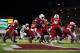 Dec 28, 2013; Orlando, FL, USA; Louisville Cardinals quarterback Teddy Bridgewater (5) hands off to running back Dominique Brown (10) in the first quarter of the Russell Athletic Bowl against the Miami Hurricanes at Florida Citrus Bowl Stadium. Mandatory Credit: David Manning-USA TODAY Sports