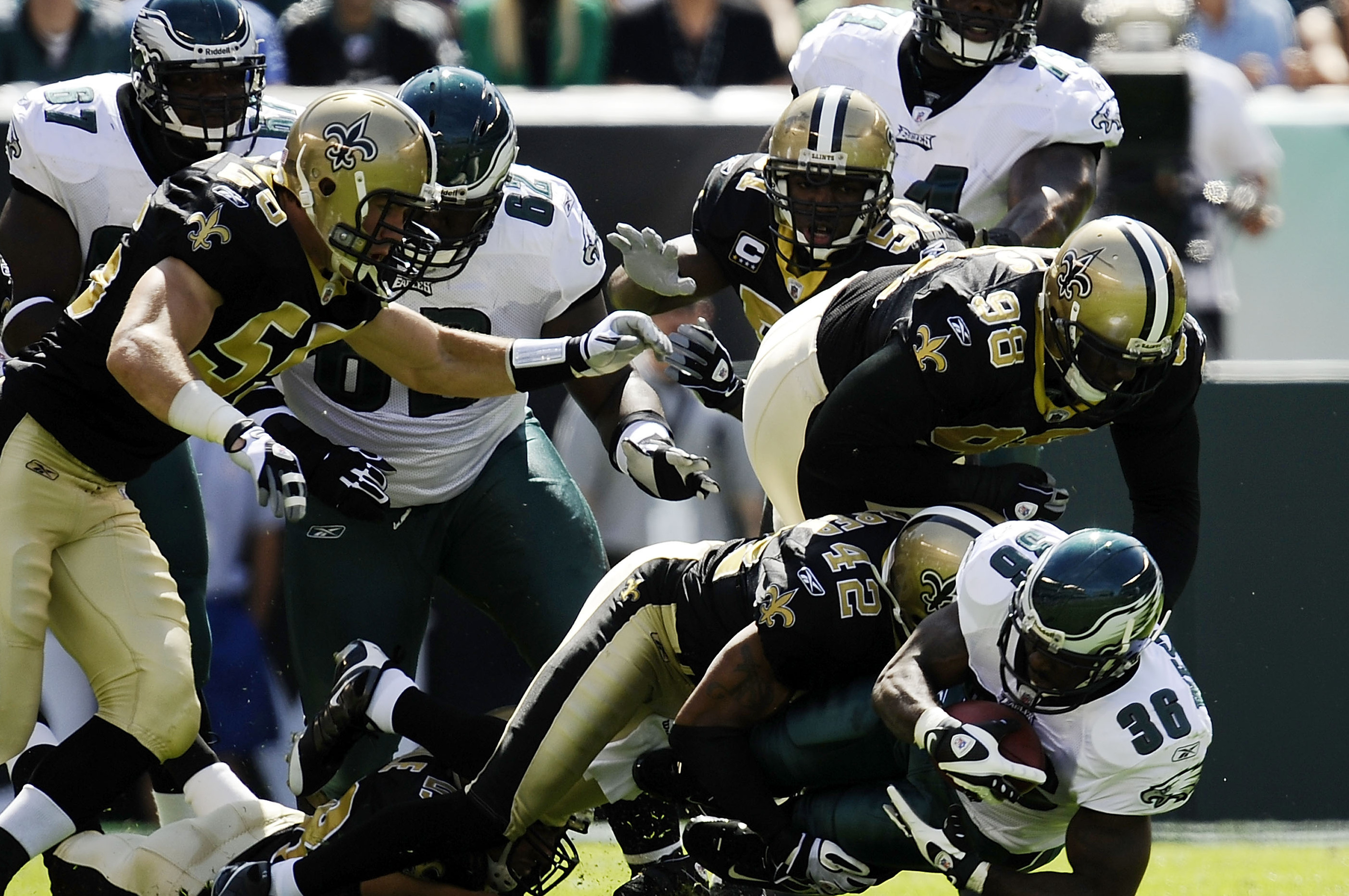 Taysom Hill New Orleans Saints Unsigned Carries The Ball in Black Jersey Photograph