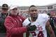 STILLWATER, OK - DECEMBER 7: Head coach Bob Stoops congratulates running back Brennan Clay #24 of the Oklahoma Sooners after the game against the Oklahoma State Cowboys December 7, 2013 at Boone Pickens Stadium in Stillwater, Oklahoma. Oklahoma defeated Oklahoma State 33-24. (Photo by Brett Deering/Getty Images)
