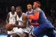Dec 5, 2013; Brooklyn, NY, USA; Brooklyn Nets shooting guard Joe Johnson (7) controls the ball in front of New York Knicks small forward Carmelo Anthony (7) during the third quarter of a game at Barclays Center. Mandatory Credit: Brad Penner-USA TODAY Sports