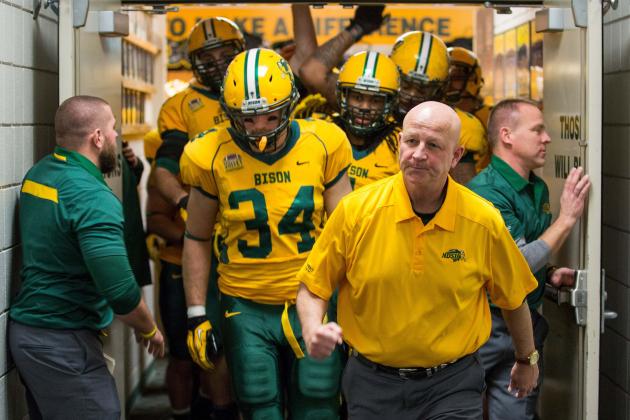 Dec 20, 2013; Fargo, ND, USA; North Dakota State Bison head coach Craig Bohl leads the team out of their locker room prior to the game against the New Hampshire Wildcats. North Dakota State won 52-14. Mandatory Credit: Brace Hemmelgarn-USA TODAY Sports
