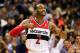 WASHINGTON, DC - DECEMBER 06: John Wall #2 of the Washington Wizards celebrates after making a basket during the closing mintues of regulation against the Milwaukee Bucks at Verizon Center on December 6, 2013 in Washington, DC. The Bucks won 109-105. NOTE TO USER: User expressly acknowledges and agrees that, by downloading and or using this photograph, User is consenting to the terms and conditions of the Getty Images License Agreement. (Photo by Rob Carr/Getty Images)