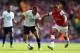 Andros Townsend and Kieran Gibbs tussle for the ball in the North London derby last September.