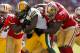 Sep 8, 2013; San Francisco, CA, USA; Green Bay Packers running back Eddie Lacy (27) is tackled by San Francisco 49ers linebacker Aldon Smith (99) and 49ers linebacker Patrick Willis (52) in the third quarter at Candlestick Park. The 49ers defeated the Packers 34-28. Mandatory Credit: Cary Edmondson-USA TODAY Sports