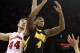 Jan 5, 2014; Madison, WI, USA; Iowa Hawkeyes guard Roy Marble (4) fights for a rebound with Wisconsin Badgers forward Sam Kaminsky (44) at the Kohl Center during the first half. Mandatory Credit: Mary Langenfeld-USA TODAY Sports