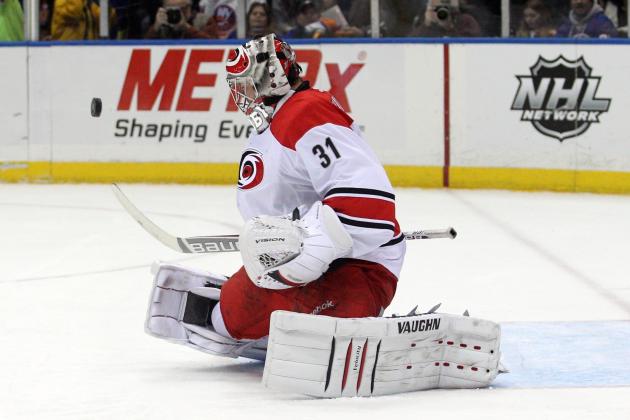 Jan 4, 2014; Uniondale, NY, USA; Carolina Hurricanes goalie Anton Khudobin (31) makes a save against the New York Islanders during the second period of a game at Nassau Veterans Memorial Coliseum. Mandatory Credit: Brad Penner-USA TODAY Sports