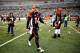 CINCINNATI, OH - JANUARY 05: Quarterback Andy Dalton #14 of the Cincinnati Bengals walks off the field after losing to the San Diego Chargers 27-10 in a Wild Card Playoff game at Paul Brown Stadium on January 5, 2014 in Cincinnati, Ohio. (Photo by Andy Lyons/Getty Images)