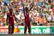 HAMILTON, NEW ZEALAND - JANUARY 08: Kirk Edwards of the West Indies (R) celebrates his century with Dwayne Bravo (L) during game five of the One Day International Series between New Zealand and the West Indies at Seddon Park on January 8, 2014 in Hamilton, New Zealand. (Photo by Phil Walter/Getty Images)
