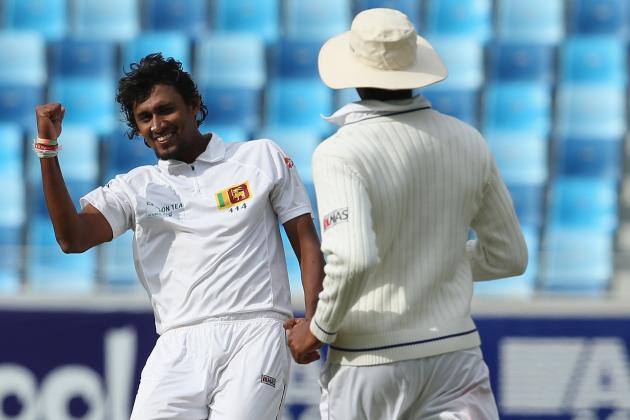 DUBAI, UNITED ARAB EMIRATES - JANUARY 08:  Shaminda Eranga of Sri Lanka celebrates after dismissing Asad Shafiq of Pakistan during the first day of the second Test match between Pakistan and Sri Lanka at the Dubai Sports City Cricket Stadium on January 8, 2014 in Dubai, United Arab Emirates.  (Photo by Francois Nel/Getty Images)