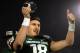 PASADENA, CA - JANUARY 01: Quarterback Connor Cook #18 of the Michigan State Spartans celebrates after receiving the offensive Rose Bowl Player of the Game Award following Michigan State's 24-20 win over the Stanford Cardinal in the 100th Rose Bowl Game presented by Vizio at the Rose Bowl on January 1, 2014 in Pasadena, California. (Photo by Harry How/Getty Images)