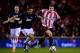 SUNDERLAND, ENGLAND - JANUARY 07: Michael Carrick of Manchester United and Adam Johnson of Sunderland battle for the ball during the Capital One Cup Semi-Final, first leg match between Sunderland and Manchester United at Stadium of Light on January 7, 2014 in Sunderland, England. (Photo by Laurence Griffiths/Getty Images)