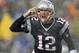 Dec 29, 2013; Foxborough, MA, USA; New England Patriots quarterback Tom Brady (12) signals his teammates at the line of scrimmage during the second quarter against the Buffalo Bills at Gillette Stadium. Mandatory Credit: Winslow Townson-USA TODAY Sports
