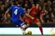 LIVERPOOL, ENGLAND - JANUARY 01: Philippe Coutinho of Liverpool competes with Alex Bruce of Hull City for the ball during the Barclays Premier League match between Liverpool and Hull City at Anfield on January 1, 2014 in Liverpool, England. (Photo by Clive Brunskill/Getty Images)