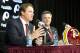 Jan 9, 2014; Ashburn, VA, USA; Washington Redskins head coach Jay Gruden speaks as general manager Bruce Allen looks on during a press conferences at Redskins Park Team Auditorium. Mandatory Credit: Brad Mills-USA TODAY Sports