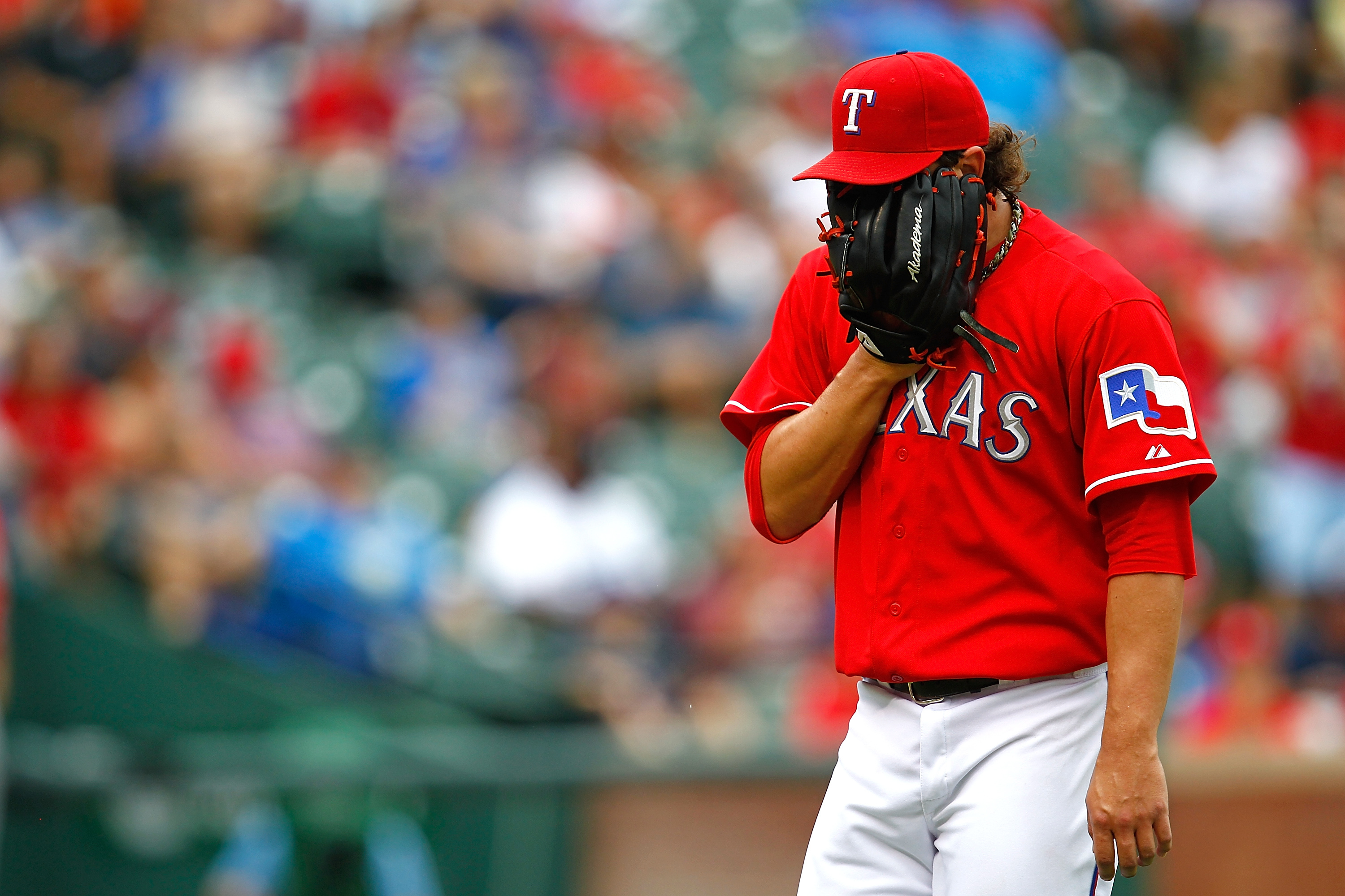 Texas Rangers' Derek Holland is sporting a 'Wild Thing' haircut