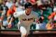 SAN FRANCISCO, CA - SEPTEMBER 8: Buster Posey #28 of the San Francisco Giants takes off running on a single to right field against the Arizona Diamondbacks in the sixth inning after returning from a finger injury at AT&T Park on September 8, 2013 in San Francisco, California. The Giants won 3-2 in 11 innings. (Photo by Brian Bahr/Getty Images)