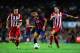 BARCELONA, SPAIN - AUGUST 28: Neymar (C) of FC Barcelona duels for the ball with Mario Suarez (R) and Gabi Fernandez of Atletico de Madrid during the Spanish Super Cup second leg match between FC Barcelona and Atletico de Madrid at Nou Camp on August 28, 2013 in Barcelona, Spain. (Photo by David Ramos/Getty Images)