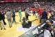 Jan 11, 2014; Washington, DC, USA; Washington Wizards and Houston Rockets players stand on the court during a delay in play for a leak in the roof during the second quarter at Verizon Center. Mandatory Credit: Geoff Burke-USA TODAY Sports