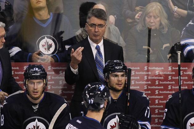WINNIPEG, MB - OCTOBER 18:  Head coach Claude Noel of the Winnipeg Jets gestures to James Wright #17 in third-period action of an NHL game against the St. Louis Blues at the MTS Centre on October 18, 2013 in Winnipeg, Manitoba, Canada. (Photo by Marianne Helm/Getty Images)