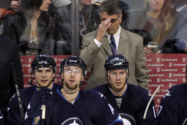 WINNIPEG, MB - JANUARY 11: Claude Noel, head coach of the Winnipeg Jets, adjusts his glasses on the bench in third period action in an NHL game against the Columbus Blue Jackets at the MTS Centre on January 11, 2014 in Winnipeg, Manitoba, Canada. (Photo by Marianne Helm/Getty Images)