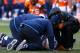DENVER, CO - JANUARY 12: Manti Te'o #50 of the San Diego Chargers receives medical attention in the second quarter against the Denver Broncos during the AFC Divisional Playoff Game at Sports Authority Field at Mile High on January 12, 2014 in Denver, Colorado. (Photo by Doug Pensinger/Getty Images)