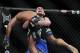 May 25, 2013; Las Vegas, NV, USA; Khabib Nurmagomedov strains to lift Abel Trujillo during UFC 160 at the MGM Grand Garden Arena. Mandatory Credit: Gary A. Vasquez-USA TODAY Sports