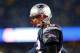 FOXBORO, MA - JANUARY 11: Tom Brady #12 of the New England Patriots looks on against the Indianapolis Colts during the AFC Divisional Playoff game at Gillette Stadium on January 11, 2014 in Foxboro, Massachusetts. (Photo by Jim Rogash/Getty Images)