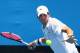 MELBOURNE, AUSTRALIA - JANUARY 14: John Isner of the United States plays a forehand in his first round match against Martin Klizan of Slovakia during day two of the 2014 Australian Open at Melbourne Park on January 14, 2014 in Melbourne, Australia. (Photo by Robert Prezioso/Getty Images)