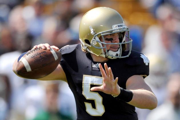 Apr. 21, 2012; South Bend, IN, USA; Notre Dame Fighting Irish quarterback Gunner Kiel (5) throws in the fourth quarter of the spring game at Notre Dame Stadium. Kiel wore the number five jersey in honor of his uncle and former Notre Dame quarterback Blair Kiel who died on April 8, 2012. Mandatory Credit: Matt Cashore-USA TODAY Sports