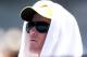 MELBOURNE, AUSTRALIA - JANUARY 14: A tennis fan avoids the sun whilst watching the action during day two of the 2014 Australian Open at Melbourne Park on January 14, 2014 in Melbourne, Australia. (Photo by Michael Dodge/Getty Images)