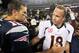 Oct 7, 2012; Foxborough, MA, USA; New England Patriots quarterback Tom Brady (12) shakes hands with Denver Broncos quarterback Peyton Manning (18) following the game at Gillette Stadium. The Patriots defeated the Broncos 31-21. Mandatory Credit: Stew Milne-USA TODAY Sports