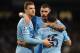 MANCHESTER, ENGLAND - JANUARY 15: Sergio Aguero of Manchester City celebrates scoring his team's fourth goal with team-mates Edin Dzeko (L) and Aleksandar Kolarov during the Budweiser FA Cup Third Round Replay match between Manchester City and Blackburn Rovers at the Etihad Stadium on January 15, 2014 in Manchester, England. (Photo by Chris Brunskill/Getty Images)