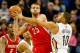 Jan 15, 2014; New Orleans, LA, USA; New Orleans Pelicans shooting guard Eric Gordon (10) defends Houston Rockets small forward Chandler Parsons (25) during the first quarter of a game at the New Orleans Arena. Mandatory Credit: Derick E. Hingle-USA TODAY Sports