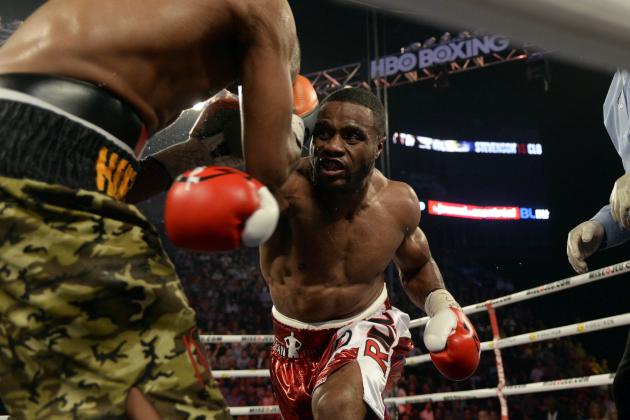 Sep 28, 2013; Montreal, Quebec, Canada; Jean Pascal (red trunks) and George Blades (camouflage trunks) box during their light-heavyweight bout at the Bell Centre. Mandatory Credit: Eric Bolte-USA TODAY Sports