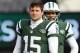 EAST RUTHERFORD, NJ - DECEMBER 23: Quarterbacks Tim Tebow #15 and Mark Sanchez #6, look on as teammate Greg McElroy #14 of the New York Jets passes before the start of their game against the San Diego Chargers at MetLife Stadium on December 23, 2012 in East Rutherford, New Jersey. (Photo by Rich Schultz/Getty Images)