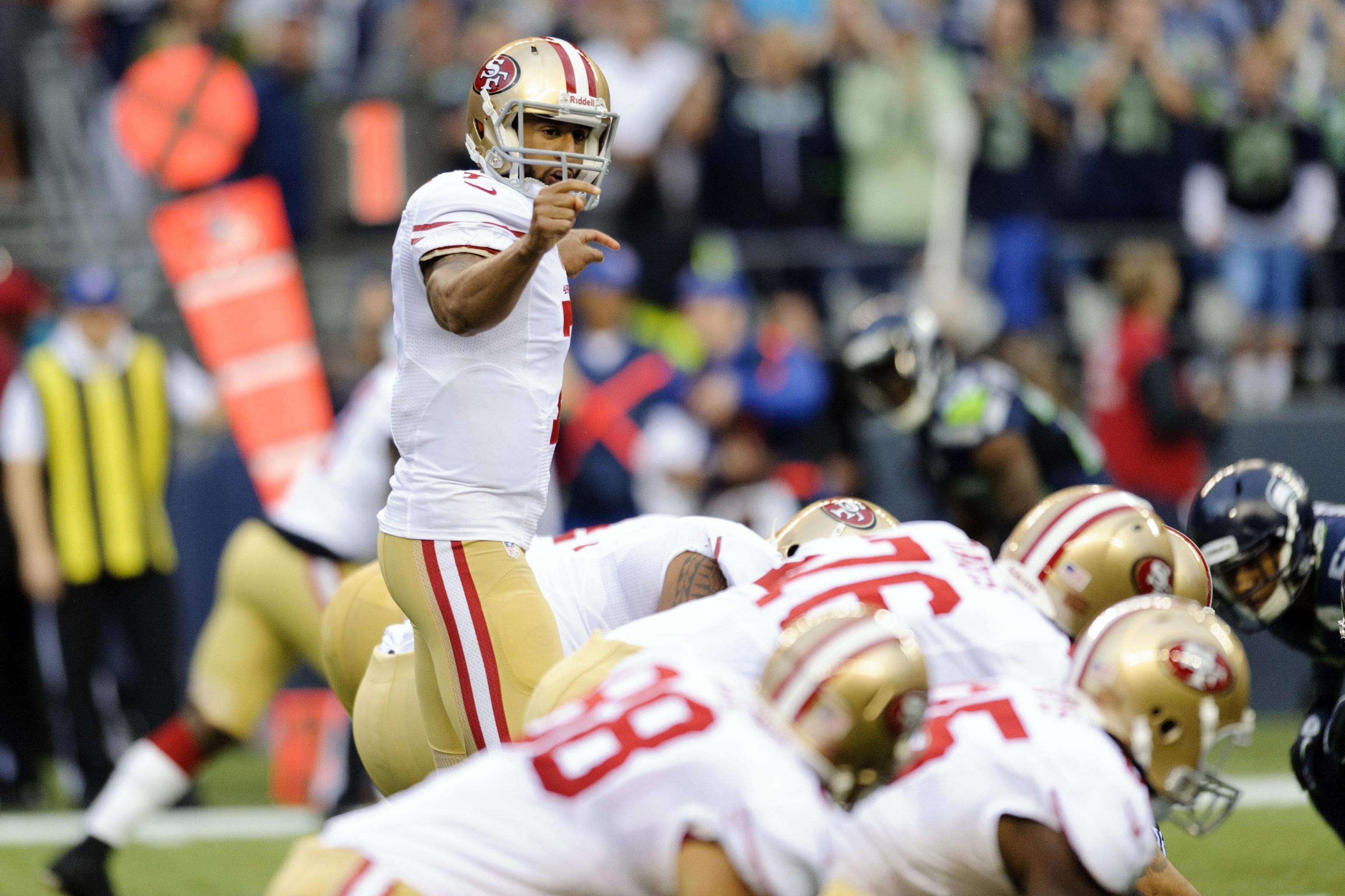 Seattle Seahawks strong safety Kam Chancellor sacks San Francisco 49ers  quarterback Colin Kaepernick in the fourth quarter at CenturyLink Field in  Seattle, Washington on September 15, 2013. The Seattle defense held  Kaepernick