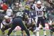 SEATTLE, WA - OCTOBER 14: Tom Brady #12 of the New England Patriots calls a play at the line of scrimmage during a game against the Seattle Seahawks at CenturyLink Field on October 14, 2012 in Seattle, Washington. The Seahawks beat the Patriots 24-23. (Photo by Stephen Brashear/Getty Images)