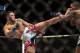 Jan 15, 2014; Duluth, GA, USA; Lorenz Larkin (red gloves) fights Brad Tavares (blue gloves) during UFC Fight Night at Gwinnett Center. Mandatory Credit: Joshua S. Kelly-USA TODAY Sports