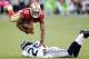 San Francisco 49ers wide receiver Michael Crabtree (15) jumps over Seattle Seahawks cornerback Richard Sherman (25) during the first quarter of an NFL football game in San Francisco, Thursday, Oct. 18, 2012. (AP Photo/Ben Margot)