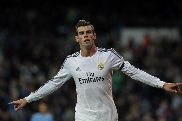 Real Madrid's Gareth Bale celebrates his goal during a Spanish La Liga soccer match between Real Madrid and Valladolid at the Santiago Bernabeu stadium in Madrid, Spain, Saturday, Nov. 30, 2013. (AP Photo/Andres Kudacki)