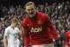 Manchester United's Wayne Rooney celebrates his penalty goal against Tottenham Hotspur during their English Premier League soccer match at White Hart Lane, London, Sunday, Dec. 1, 2013. (AP Photo/Sang Tan)