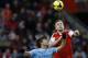 Southampton's Luke Shaw, right, vies for the ball with Manchester City's Sergio Aguero during the English Premier League soccer match between Southampton and Manchester City at St Mary's Stadium in Southampton, England Saturday, Dec. 7, 2013. (AP Photo/Kirsty Wigglesworth)