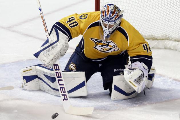 Nashville Predators goalie Devan Dubnyk (40) makes a stop against the Colorado Avalanche in the second period of an NHL hockey game Saturday, Jan. 18, 2014, in Nashville, Tenn. The game is Dubnyk's first in goal for the Predators since being acquired from the Edmonton Oilers. (AP Photo/Mark Humphrey)