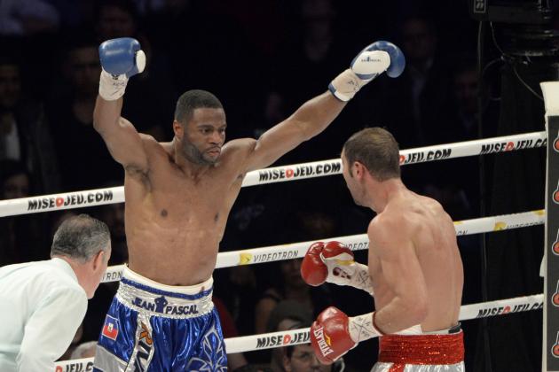 Jan 18, 2014; Montreal, Quebec, Canada; Jean Pascal (blue trunks) reacts during their NABF light heavyweight title bout against Lucian Bute (right) at the Bell Centre. Mandatory Credit: Eric Bolte-USA TODAY Sports