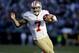 San Francisco 49ers quarterback Colin Kaepernick (7) carries the ball against the Carolina Panthers during the second half of a divisional playoff NFL football game, Sunday, Jan. 12, 2014, in Charlotte, N.C. (AP Photo/Gerry Broome)
